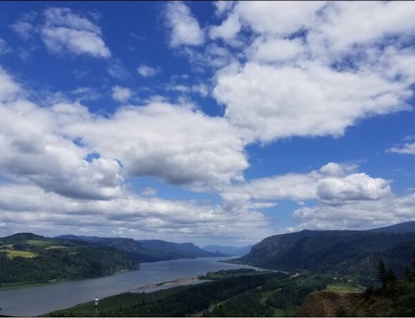 View of water, hills, and sky in Portland, Oregon.