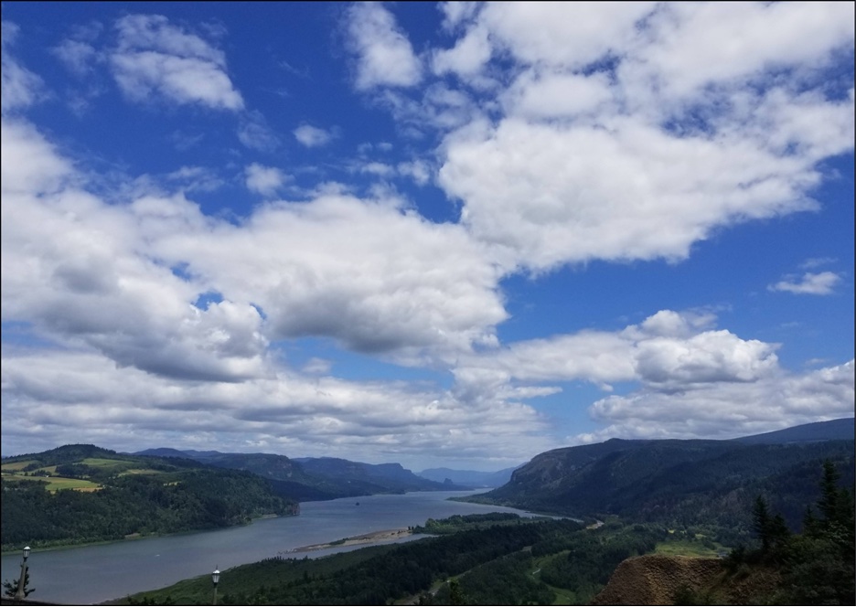 View of water, hills, and sky in Portland, Oregon.