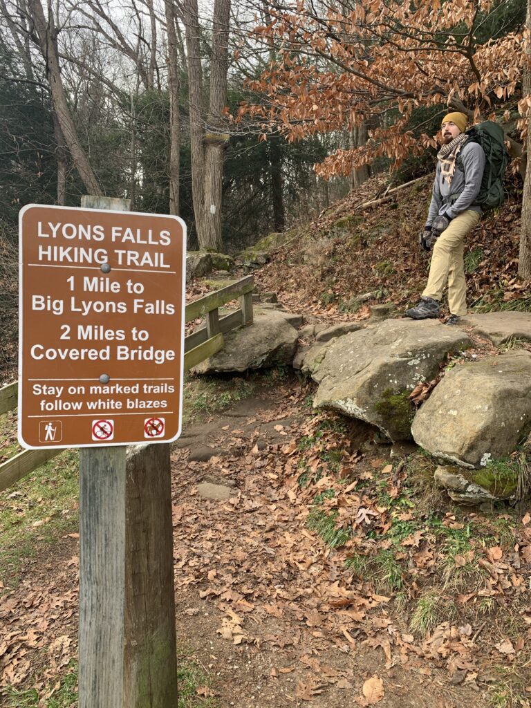 Ryan standing at Lyon Falls trail head at Mohican State Park in Ohio.